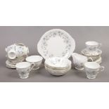 A Colcough bone chain teaset in the Rhapsody in blue design, approximately 36 pieces.