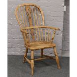 A stripped ash / elm Windsor arm chair.