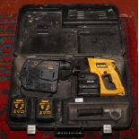 A cased Dewalt DW004 24 volt cordless hammer drill.