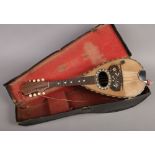 A cased Italian Pietro Esparza mandolin with tortoise shell inlay.Condition report intended as a