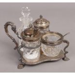 A Victorian assembled silver and cut glass four bottle cruet set, the stand by Holland Son &