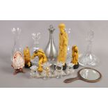 A group of collectables including a Swarovski crystal candelabra, cut glass decanters, composite