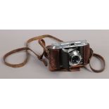 A Voightlander Vito II 35mm folding camera fitted with color - skop 50mm lens in makers leather