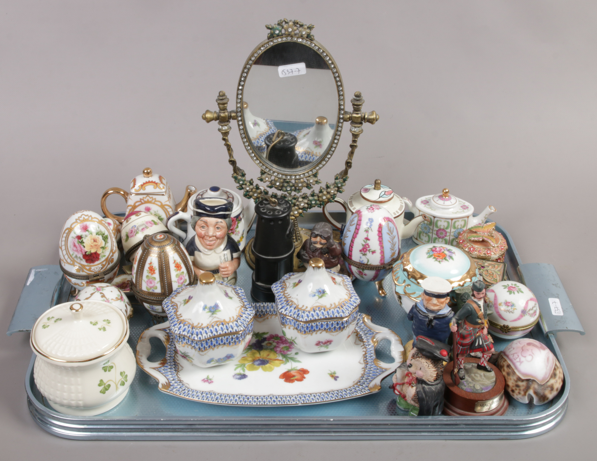 A tray of collectables including porcelain trinket boxes, bonbonnieres, Britain's lead Macgregor