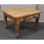 A Victorian pine scrub top kitchen table raised on turned supports with two cutlery drawers.