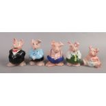 Five Natwest Wade piggy banks.Condition report intended as a guide only.Woody damaged.