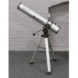 A Celestron reflector telescope on tripod with K20 eye piece.