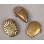 Three late 19th / early 20th century brass vesta cases, including one formed as a mussel shell.