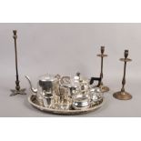 A collection of metalwares to include Viners and Walker & Hall silver plate, brass candle sticks