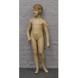 An Art Deco jointed shop mannequin formed as a young girl.