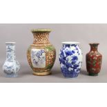 Two Chinese blue and white vases, along with a Chinese red ground cloisonne vase and a decorated