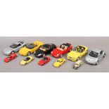 Six Burago models of sports cars along with a selection of Maisto model cars