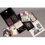 A collection of coins to include cased specimen coin 1937 part set, cased Royal Mint proof sets,