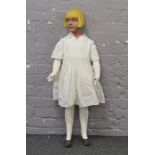 A vintage shop mannequin of a little girl with a blonde bobcut.Condition report intended as a