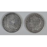 A Mexican silver pillar dollar 8 Reales coin 1814, along with an American dollar 1921.