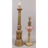 Two gilt table lamp bases, a metal example formed as an oil lamp, along with a plaster reeded