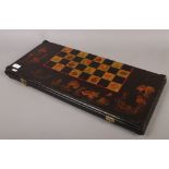 A Japanese lacquered chess / gaming board decorated with fish, along with a collection of ebonised