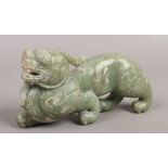 A jade coloured hardstone carving of a Chinese mythical beast.