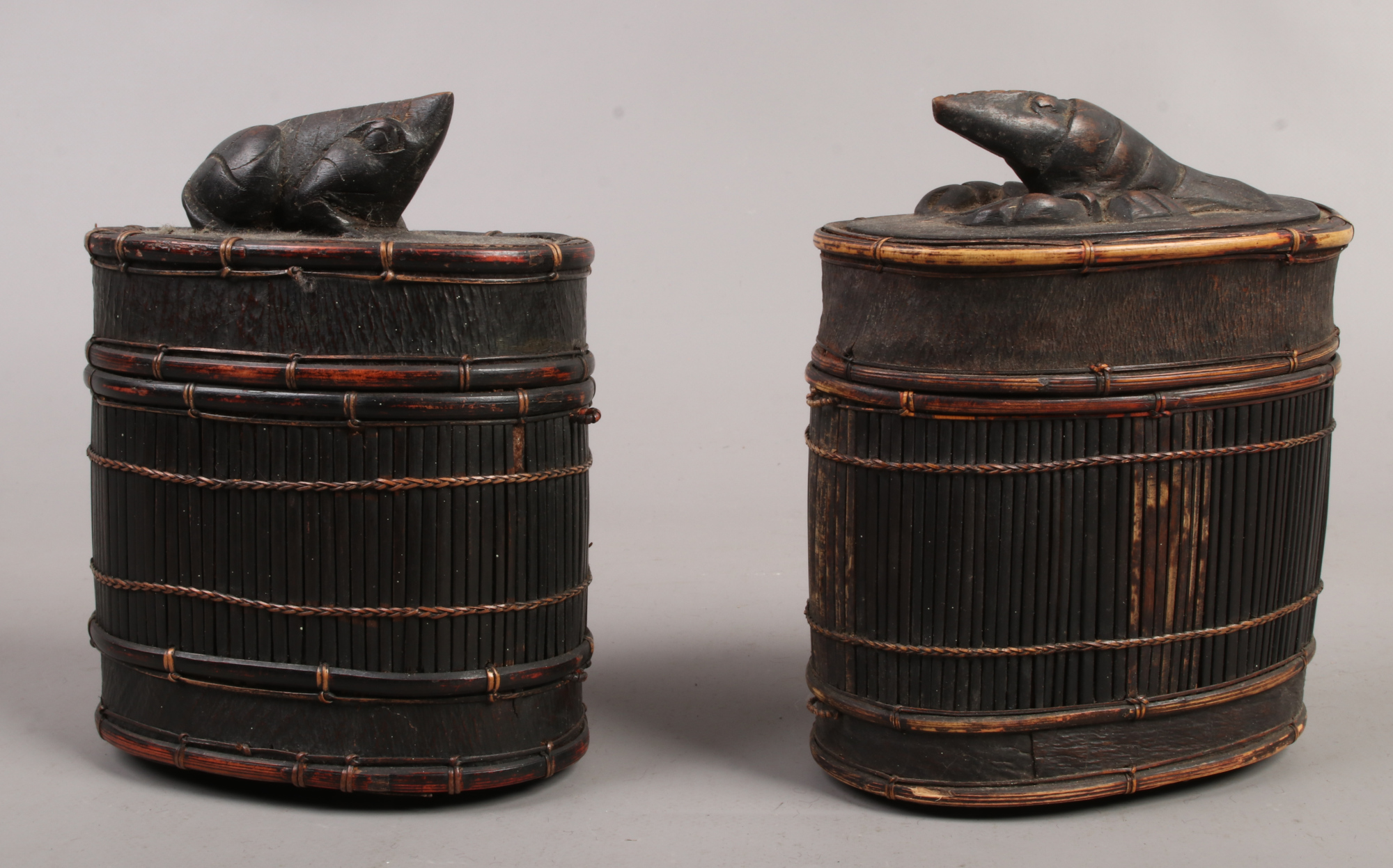 Two early 20th century Chinese bamboo cages, one surmounted with a carved crayfish finial the