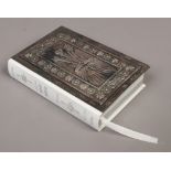 An ornate Britannia silver mounted bible, Prince of Wales feathers design, assayed London.