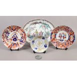 Two 19th century Japanese Imari chargers, along with a Chinese bronze hand mirror, an early 20th