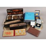 A collection of British and World coins to include two Royal Mint cased silver commemorative coins.