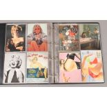 An album of postcards to include holographic, erotic, film etc.