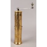 A brass Trosser pepper mill / grinder.