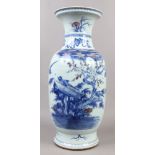 A large Chinese baluster vase painted in underglaze blue and iron red with birds amidst prunus