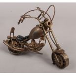 A scrap metal art model of a motor bike.