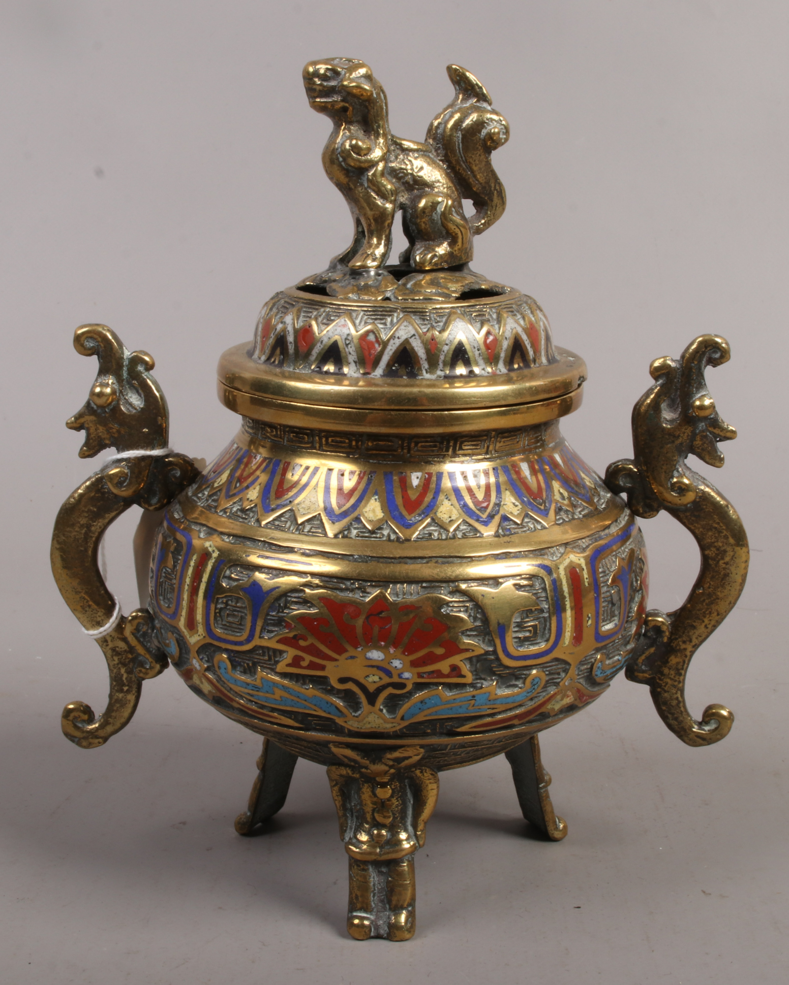 A decorative brass Japanese koro with cloisonne decoration dog of fo terminal and twin dragon