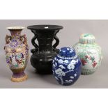 Two Chinese ginger jars one with blue and white prunus blossom decoration, along with a Satsuma