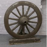 A 20th century 14 spoke wagon wheel / garden feature.