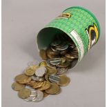 A tin of various tokens.