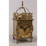 A brass Smiths 8 day lantern clock.Condition report intended as a guide only.For repair.