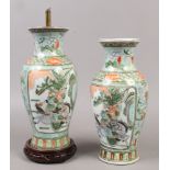 A pair of Chinese famille vert baluster vases, painted with figures in the landscape, both converted