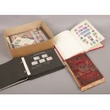 A box of world stamps in albums and sleeves to include 19th and early 20th century examples.