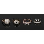 Four 9ct gold dress rings set with white and coloured paste stones.