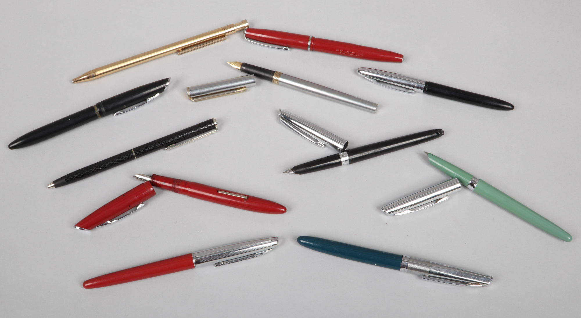 A collection of fountain and ball point pens to include a Sheaffer example.
