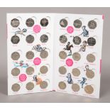 A complete Royal Mint official London 2012 50p sports collection album.