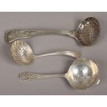 Three silver and white metal sugar sifter spoons to include Sheffield 1961 by Viners Ltd example.
