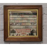 A framed Victorian sampler Susan Crowther aged 10 years 1884.