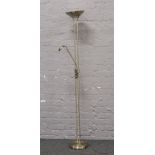 A brushed brass effect standard lamp with uplight and adjustable reading lamp.