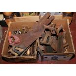 Two boxes of hand tools including hand saws, wood turning chisels, spanners, hammers, drivers etc.