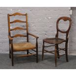 A rush seat ladder back arm chair along with a bergere seat balloon back chair.