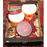 A box of musical instruments mostly for use in Morris Dance including hand bells, drums etc.