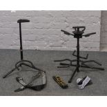 A three guitar stand along with a Stagg guitar and three guitar straps including a Fender example.