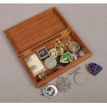 A box of medals and badges to include Masonic examples.