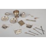 A collection of miscellaneous silver and white metal items to include spirit labels, egg cup, salt