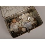 A tin of British pre-decimal coins to include half crowns, two shillings, pennies, war medal, six